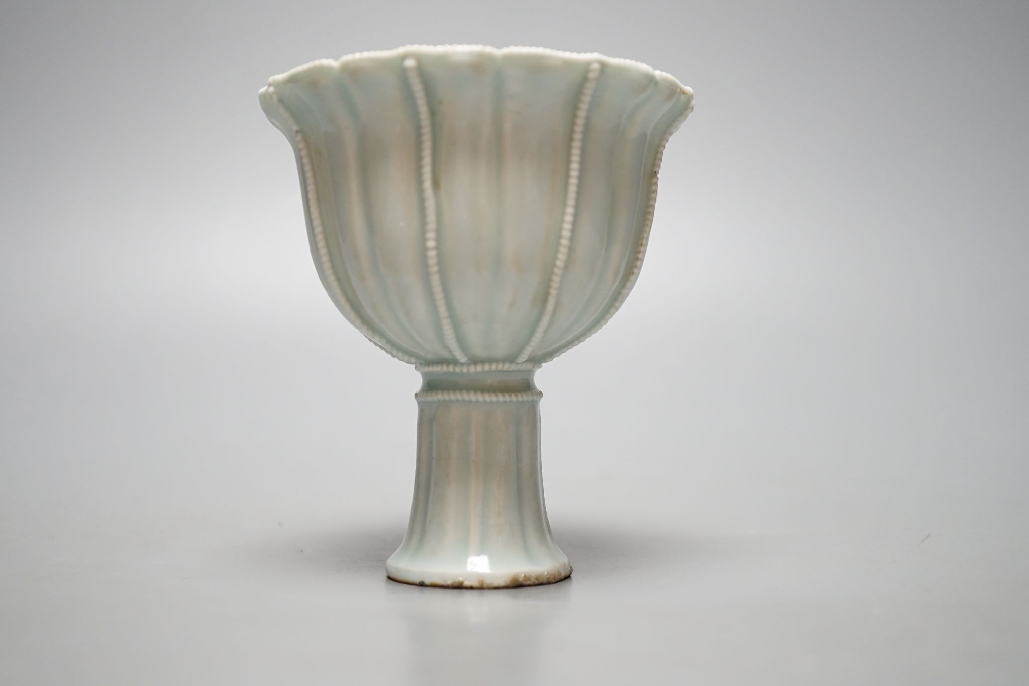 A Chinese Qingbai type stem cup., 10 cms high.